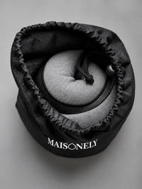 The pillow's black carry bag
